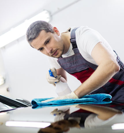 man polishing a car