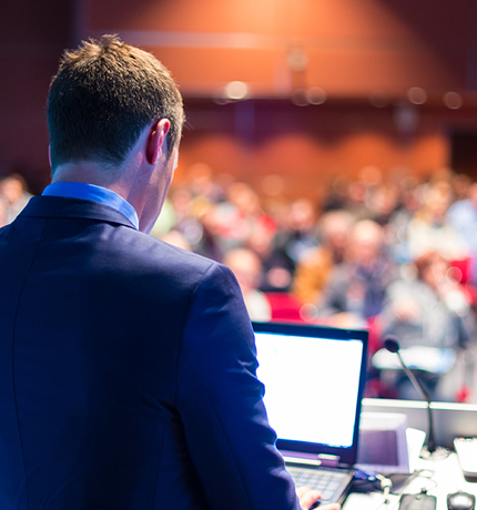 man presenting at a trade show