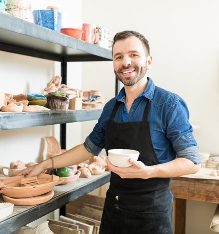 man in pottery workshop