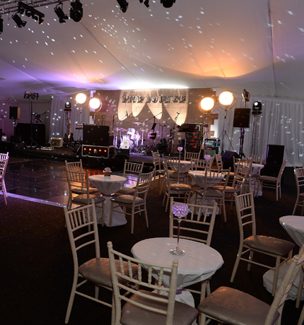 inside a party tent at night with flasing lights