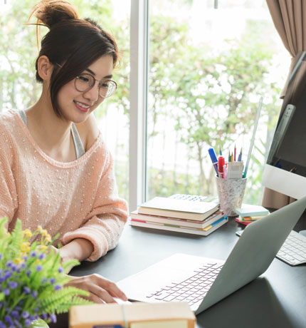 organized women sitting infront of computer