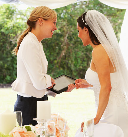 wedding planner talking with bride