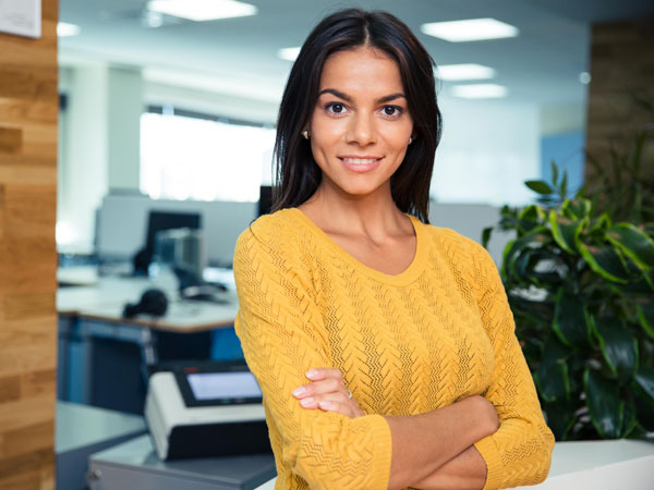 women court reporter standing in a office