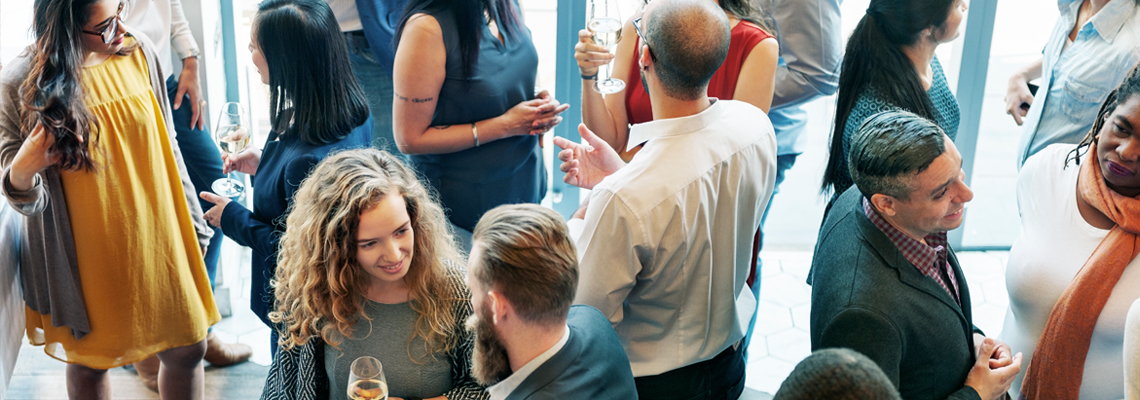 large group of people having drinks at a social gathering