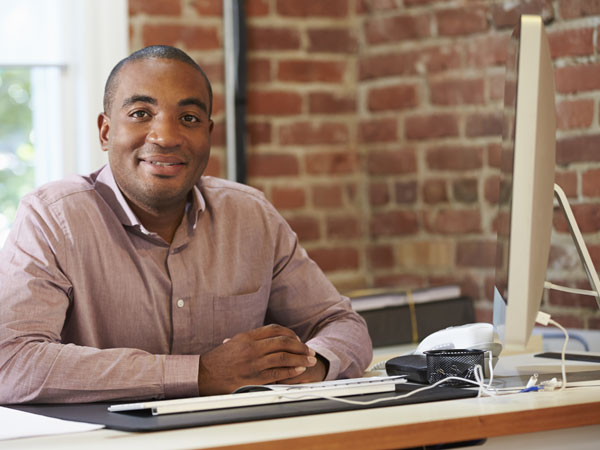 tax preparer sitting a desk